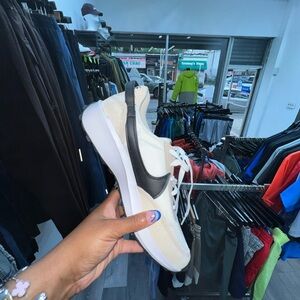 Nike Cream and Black Athletic Shoes Sleek Design